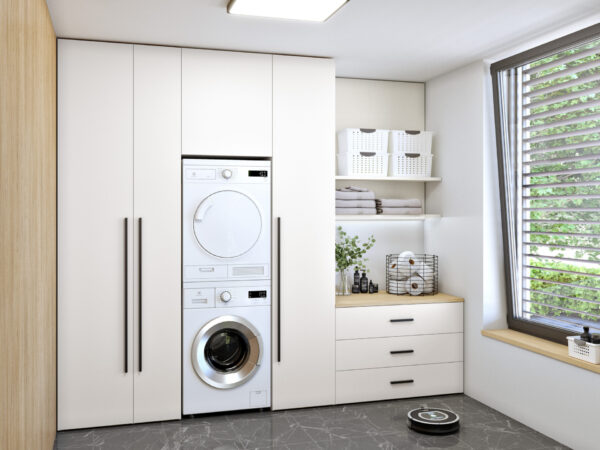 Built-in wardrobe with classic doors in the laundry room, providing order and clarity.